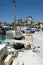 Marsaxlokk, Malta, August 2019. Primitive devices for mooring ships and the view of the embankment ..