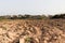 Marsaxlokk, Malta, August 2019. Reddish soil on a Maltese plowed field.