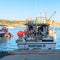 Marsaxlokk, Malta, August 2019. View from the stern of a fishing boat moored at the pier.