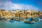 Marsaxlokk, Malta - Traditional colorful maltese Luzzu fisherboats at the old village of Marsaxlokk