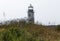 Marshall Piont Lighthouse with shrubs and flowers