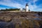 Marshall Point Light as seen from the rocky coast of Port Clyde, Maine.