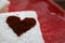 Marshmallow with Cocoa Dusted Hearts Red Plate Closeup and Space