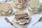 Marshmallow sandwich decorated with chocolate and decorative sprinkles. Set with decoration of different colors. Heather branches