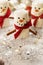 Marshmallow snowmen with snow and gliter, Christmas food background