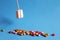 Marshmallow on wooden skewer with color sweets on blue background. holiday concept