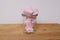 Marshmallows colorful white and pink in glass cup  on white background. Sweet candy dessert.