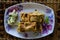 MARTABAK TELUR - stuffed pancake or pan-fried bread Indo-style on a plate, centered from top