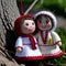 Martenitsa, white and red strains of yarn, Bulgarian folklore tradition in spring. Two dolls woman. Baba Marta Day on
