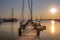 Marthas Vineyard, MA / United States-May 29, 2016: Sail boat and motor boat tied to the dock Martha's Vineyard