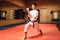 Martial arts master on fight training in gym