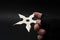 Martial arts skill and traditional Japanese weapon concept with hand in fingerless ninja glove trowing metal star shaped shuriken