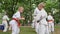 Martial arts training in park, sports for kids, boys in kimono participate single fight, karate outdoors, fight children