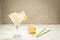 Martini cocktail with ice and a lemon/Martini cocktail with ice and a lemon on a white background. Selective focus and copy space