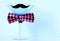 Martini glass with mustache and bow tie and copy space.