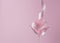 Martini glass with pink party ribbon. Minimal celebration concept