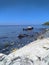 Marvelous view of white and black stones on the beach during low tide in Manatuto beach, Timor-Leste.