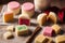 Marzipan. Variety of desserts and cakes on wooden background. Generative AI