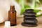 Masage rocks and bottle of aromatherapy oil