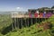 Masai blankets hang on deck overlooking Great Rift Valley in springtime, Kenya, Africa