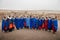 Masai or Maasai tribe woman in blue cloth wearing headpiece and ornaments. Ethnic group of Ngorongoro Consevation, Serengeti in