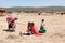 Masai People, Women and Children of Maasai Tribe sitting on ground, Tanzania, Africa