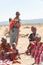 Masai People, Women and Children of Maasai Tribe sitting on ground, Tanzania, Africa