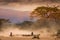 Masai shepherds with herd of goats on african savannah