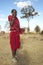 Masai Warrior using cell phone in village of Nairobi National Park, Nairobi, Kenya, Africa