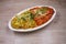 Masala Anda Bhurji combo or Spicy Indian scrambled eggs combo Popular street food in Mumbai. Served in white crockery over moody