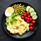 Mashed potato with green peas, tomatoes and boiled egg. Potato puree on plate with vegetables and egg