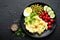 Mashed potato with green peas, tomatoes and boiled egg. Potato puree on plate with vegetables and egg