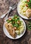 Mashed potatoes, baked garlic chicken breast and arugula, cherry tomatoes salad. Healthy food concept. Delicious lunch on wooden b