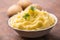 Mashed potatoes in bowl decorated with parsley herbs