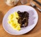 Mashed puree potatoes with fried chicken liver as main course with sauerkraut fermented cabbage