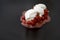 Mashed strawberries with sour cream and sugar, isolated on black