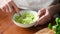 Mashing avocado in bowl, healthy cooking