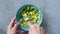 Mashing avocado with fork for guacamole