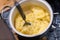 Mashing potatoes with a hand in a pot - sometimes called smashed potatoes