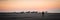 Masirah Island, Oman, December 31, 2019: beautiful panoramic image of a loving couple taking a walk on the beach with boats