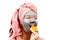 Mask for skin woman, girl bites an orange, happy and funny girl makes a mask for face skin, photo