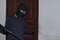 Masked burglar with balaclava holding crowbar to breaking into a house at night time. Crime concept.