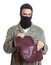 Masked burglar with stolen handbag