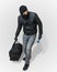 Masked burglar or thief with balaclava is creeping with black ba