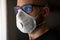 Masked caucasian sad man with glasses during Chinese infection coronavirus, concept of the epidemic of the virus . China, Italy, E