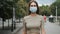 Masked face woman walk urban park corona virus. People nature closeup covid-19.