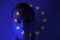 Masked man on the background of the flag of the European Union. Epidemic, dangerous crown virus of 2020. Infection and mass