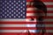 Masked man on the background of the USA flag. Epidemic, dangerous crown virus of 2020. Infection and mass diseases