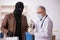 Masked man burglar bribing old doctor for getting vaccine