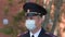 Masked portrait officer police patrolling order street corona virus covid-19 4K.